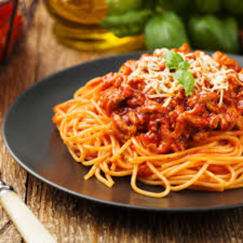 Spaghetti dish with tomato sauce and cheese on a dark plate, served on a wooden table.